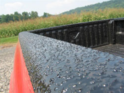 truck rail with spray bedliner applied